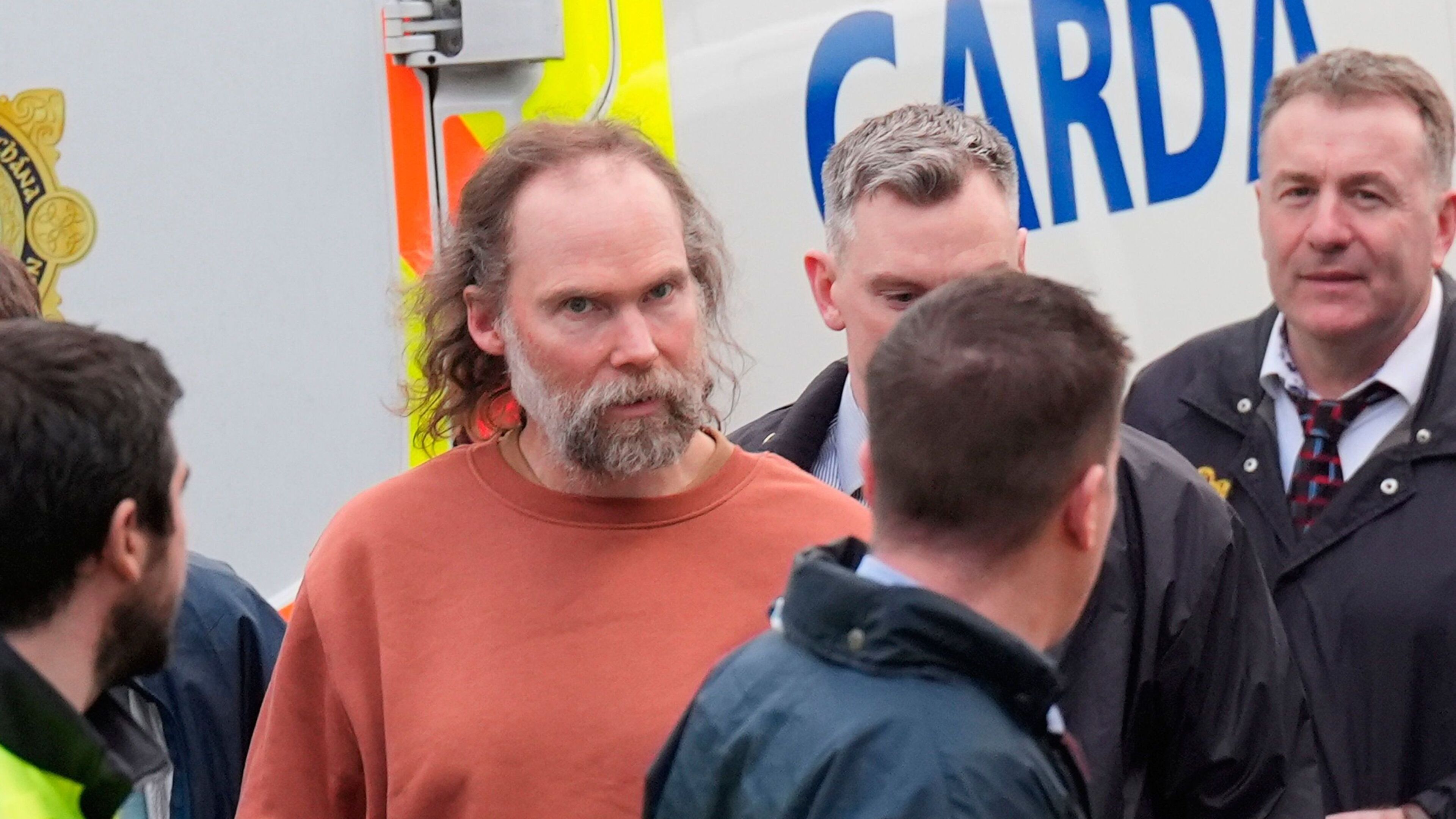 Wife of Kerry farmer Mike Gaine watches as accused appears in court and is served book of evidence